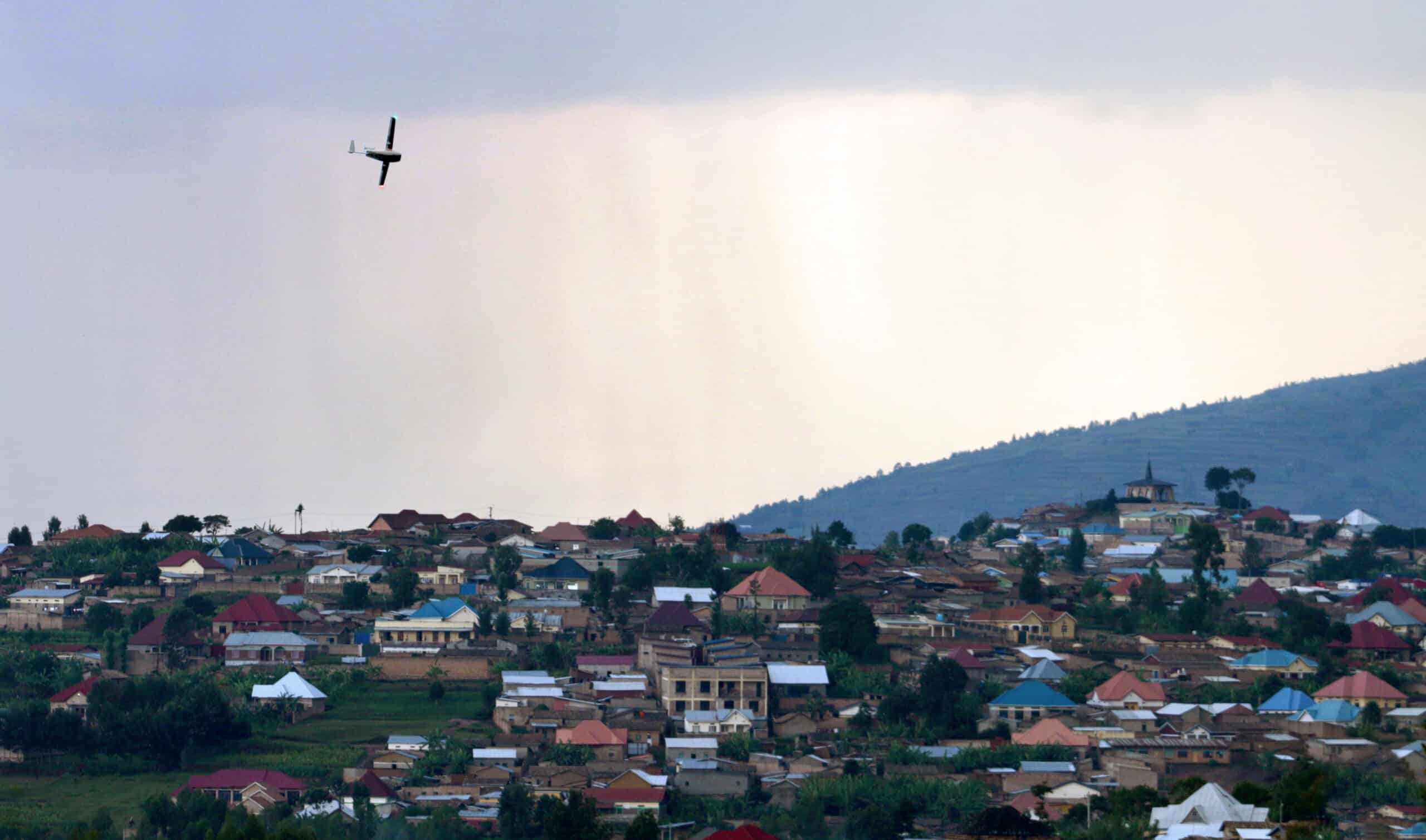 A drone flies over buildings in Muhanga, Rwanda.