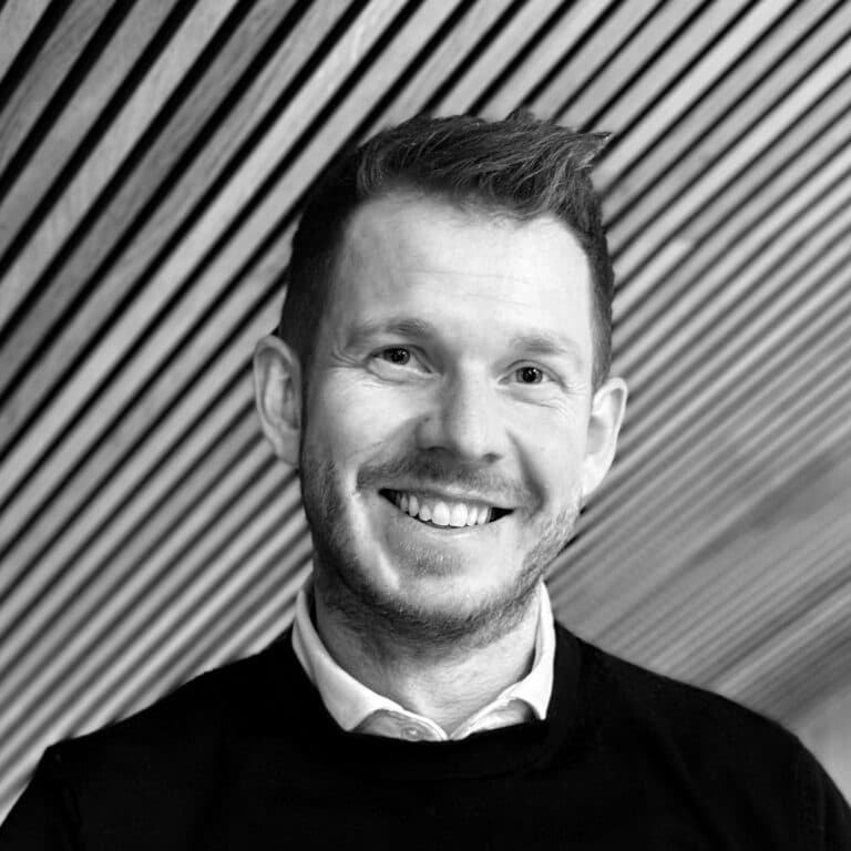 Senior Project Manager Torsten Worm smiles.